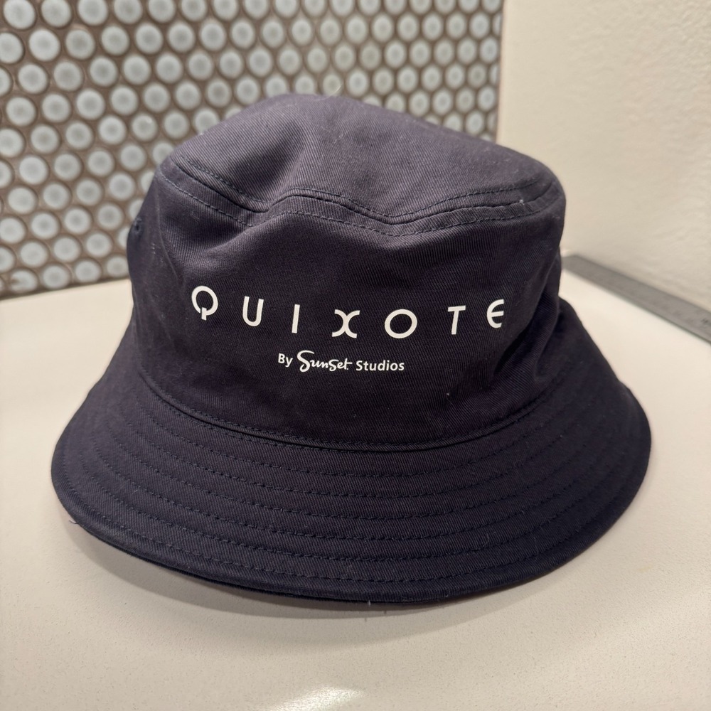 Quixote Hat Cap Bucket Hat Sunset Studio Black Logo Spellout Casual Y2K Outdoor